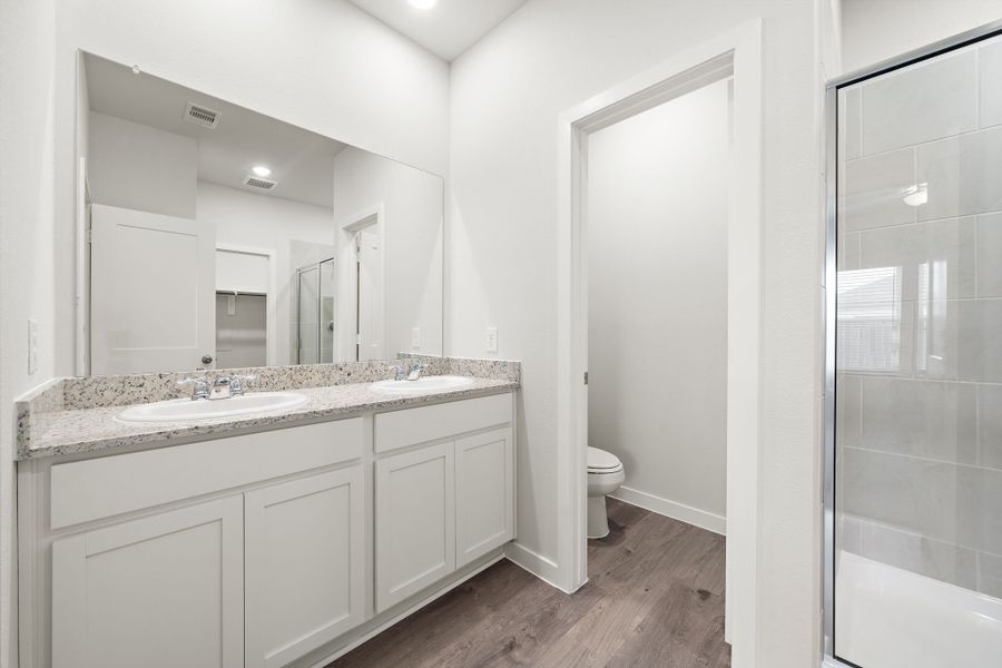 A bathroom with a glass shower.