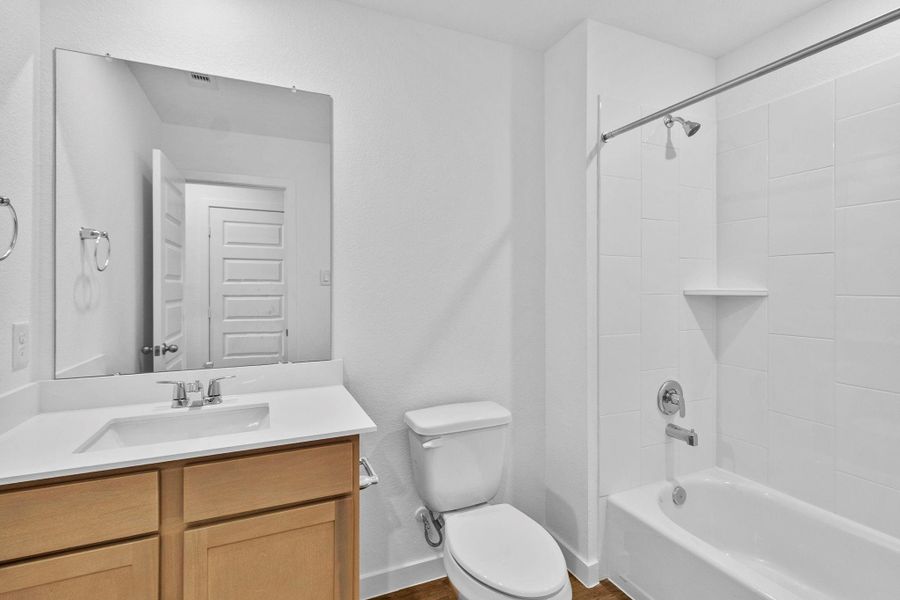 Furnished interior view inside a new home in Grand West, Houston (Image 6).