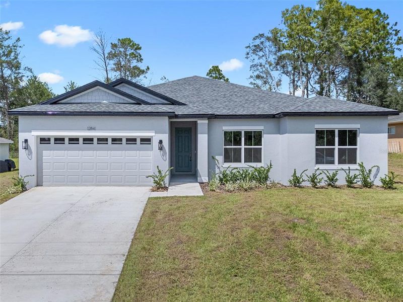 Front exterior of a new home in , Ocala, FL, highlighting curb appeal (Image 2).