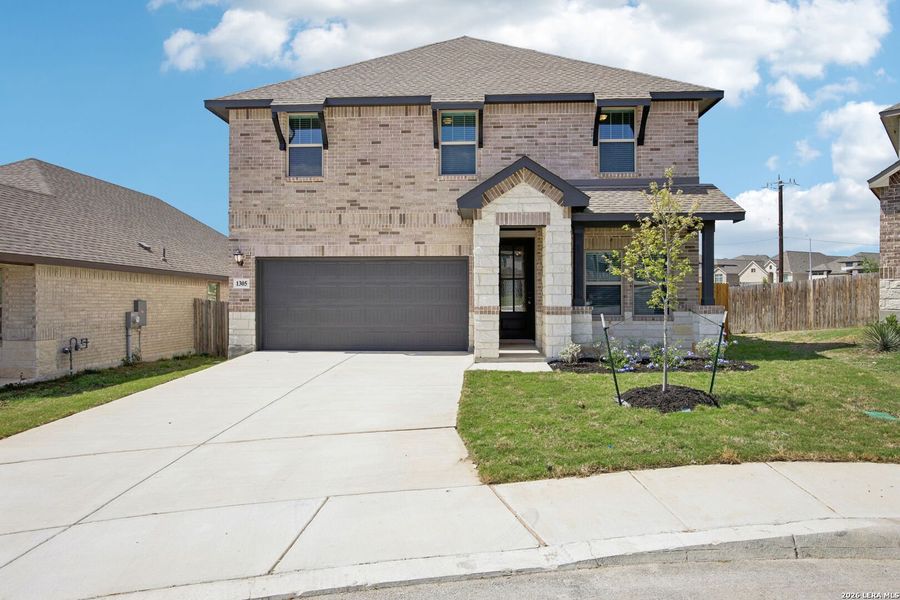 Front exterior of a new home in Arcadia Ridge - Premier Series, San Antonio, TX, highlighting curb appeal (Image 25).
