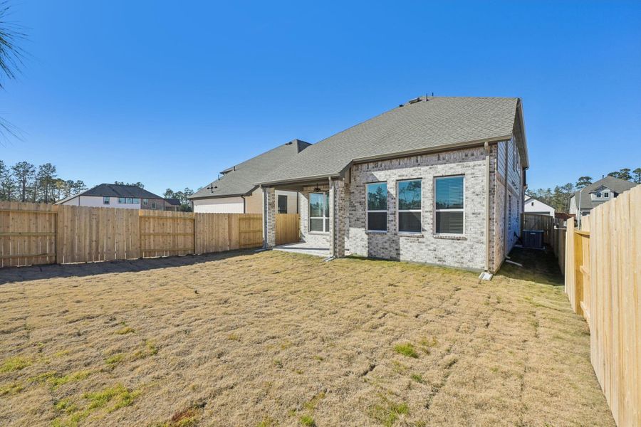 Exterior details and patio area of a home in Evergreen, Conroe (Image 4).