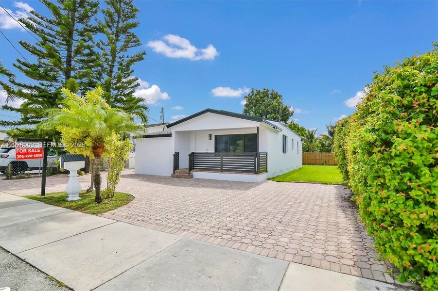 Front exterior of a new home in , Miami, FL, highlighting curb appeal (Image 21). Front exterior of a new home in , Miami, FL, highlighting curb appeal (Image 21).