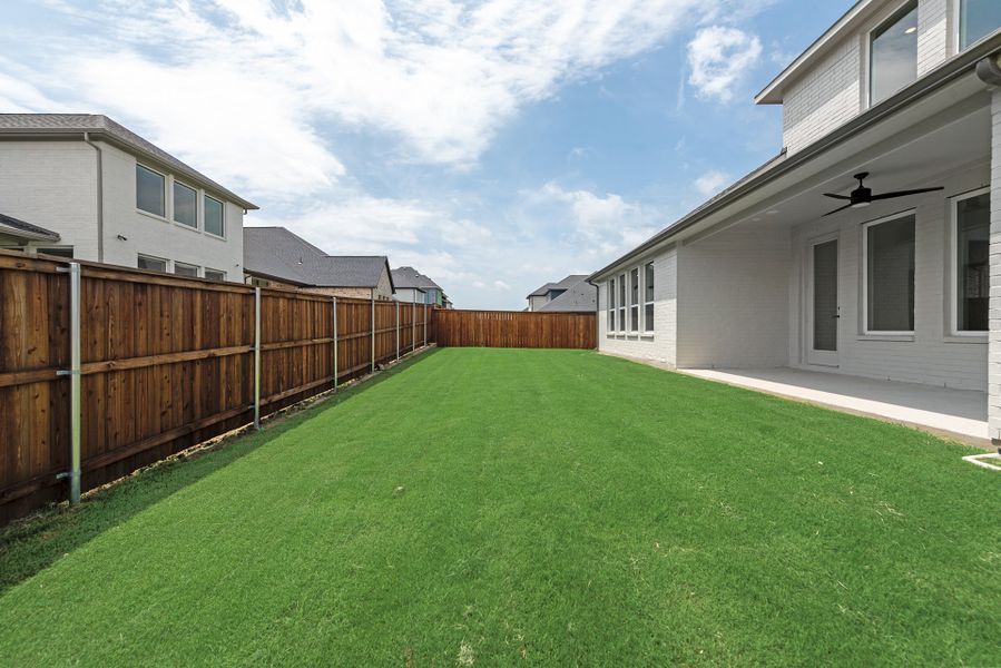 Exterior details and patio area of a home in Estates at Rockhill, Oak Point (Image 3).