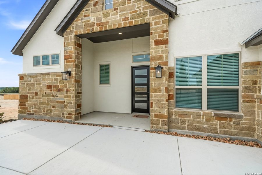 Exterior details and patio area of a home in Prominence Urban, San Antonio (Image 3).