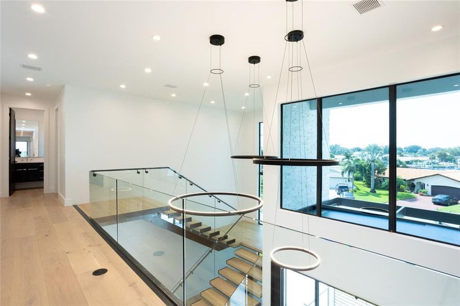 Seamless glass at the top of stairs for a sleek and modern look Seamless glass at the top of stairs for a sleek and modern look