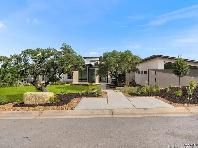 Front exterior of a new home in , Boerne, TX, highlighting curb appeal (Image 7).