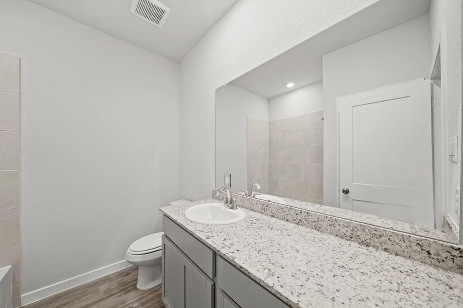 Furnished interior view inside a new home in Granger Pines, Conroe (Image 7).