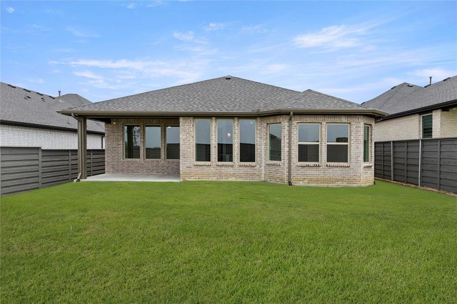 Front exterior of a new home in Discovery Collection at Union Park, Little Elm, TX, highlighting curb appeal (Image 24). Front exterior of a new home in Discovery Collection at Union Park, Little Elm, TX, highlighting curb appeal (Image 24).