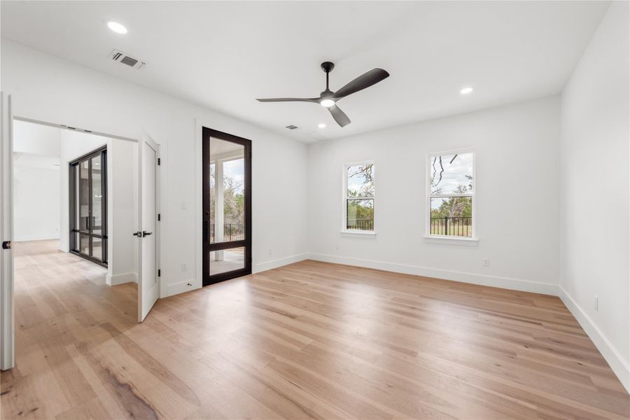 Enjoy ultimate privacy in the primary suite, which opens directly to a tranquil, tree-lined backyard retreat.