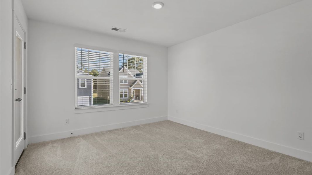 Representative furnished interior of a home built from the Freesia by DRB Homes in Harrier Point, Woodruff (Image 22).
