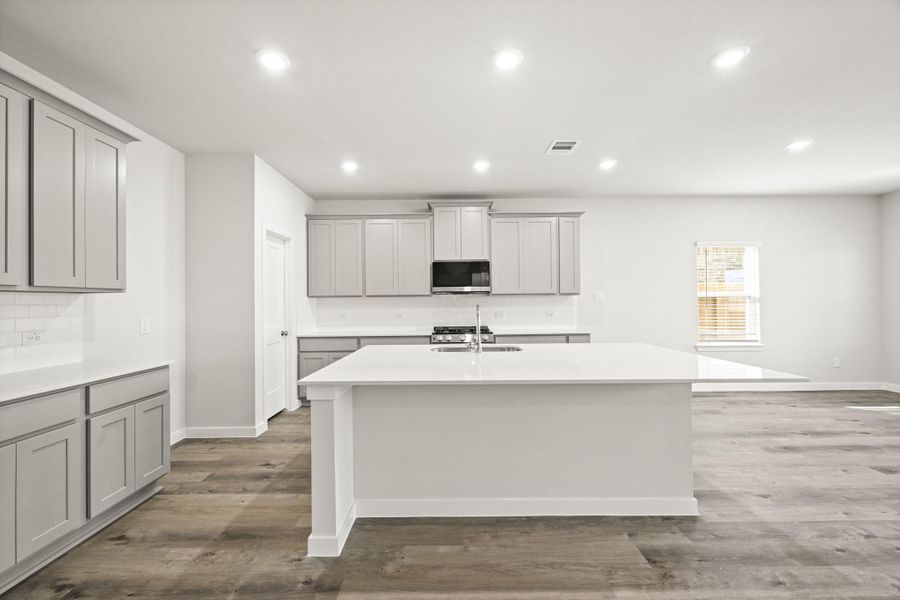 Furnished interior view inside a new home in Sunterra, Katy (Image 6).