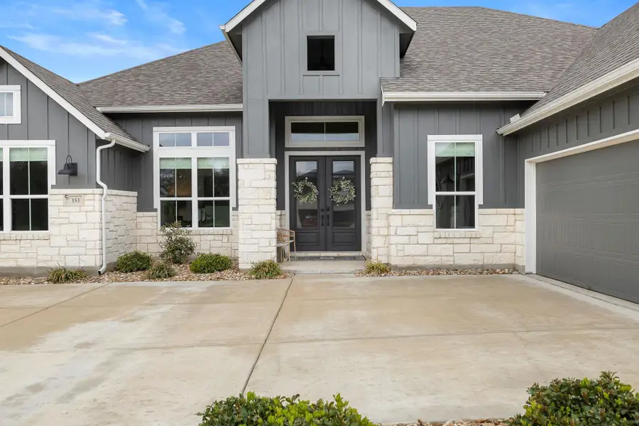 Welcoming front entry with covered porch and modern finishes.