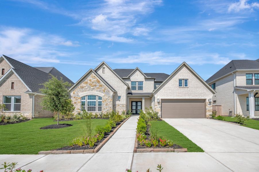 Front exterior of a new home in Sienna - Parkview Collection, Missouri City, TX, highlighting curb appeal (Image 2). Front exterior of a new home in Sienna - Parkview Collection, Missouri City, TX, highlighting curb appeal (Image 2).