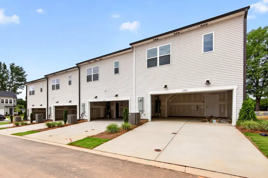 Front exterior of a new home in Amplitude, Charlotte, NC, highlighting curb appeal (Image 22).