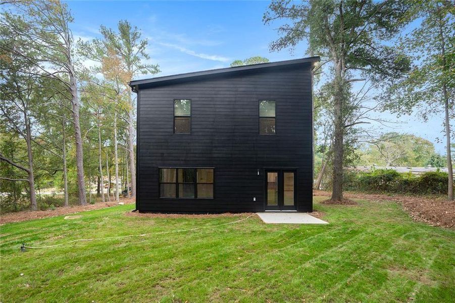 Front exterior of a new home in , Conyers, GA, highlighting curb appeal (Image 1). Front exterior of a new home in , Conyers, GA, highlighting curb appeal (Image 1).