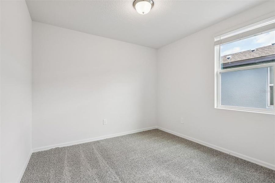 Spacious, unfurnished interior of a new home in Lake Deer Estates - Signature Series, Poinciana (Image 23).