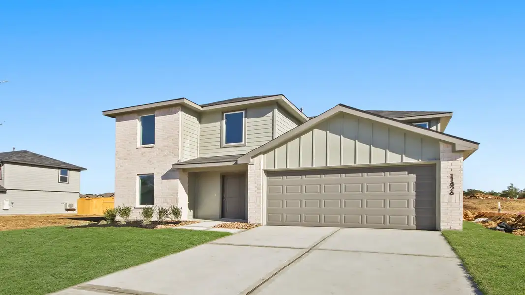 Front exterior of a new home in Lexington Heights, Willis, TX, highlighting curb appeal (Image 2).