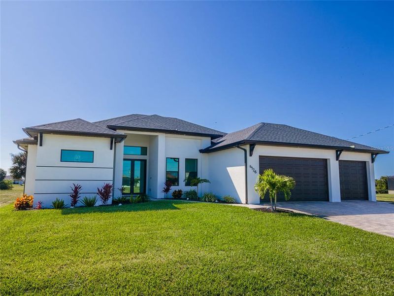 Front exterior of a new home in , Cape Coral, FL, highlighting curb appeal (Image 30). Front exterior of a new home in , Cape Coral, FL, highlighting curb appeal (Image 30).
