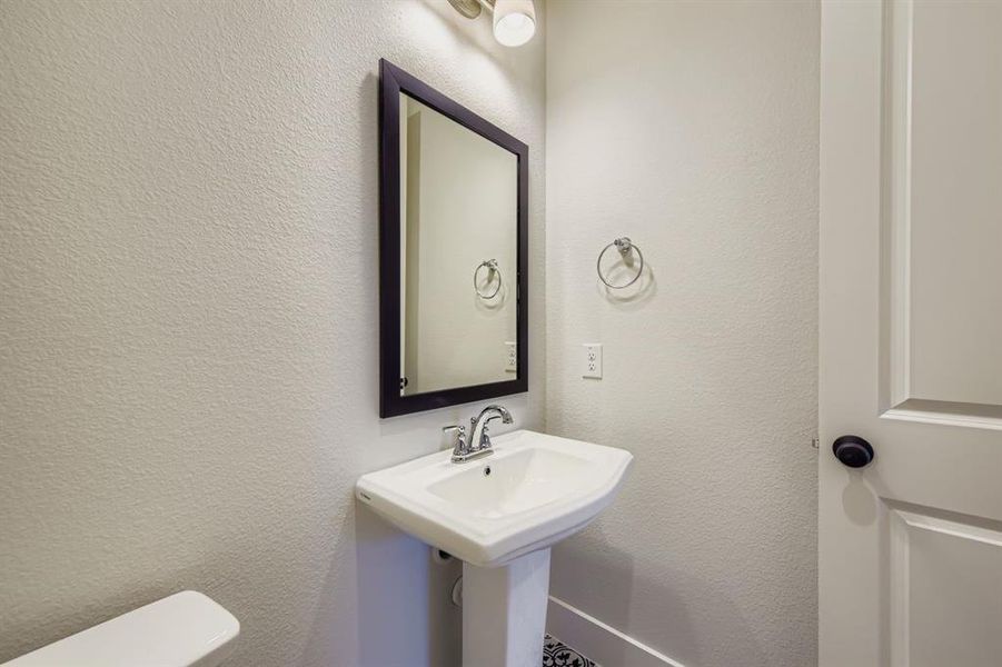 Bathroom featuring a textured wall