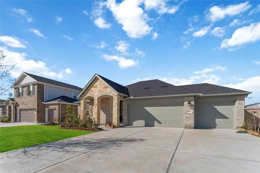 Front exterior of a new home in Sunrise Cove, Texas City, TX, highlighting curb appeal (Image 2).