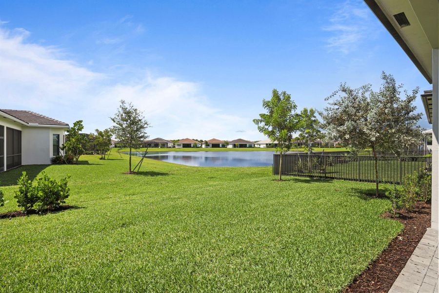 Exterior details and patio area of a home in Cresswind Palm Beach at Westlake, The Acreage (Image 33).