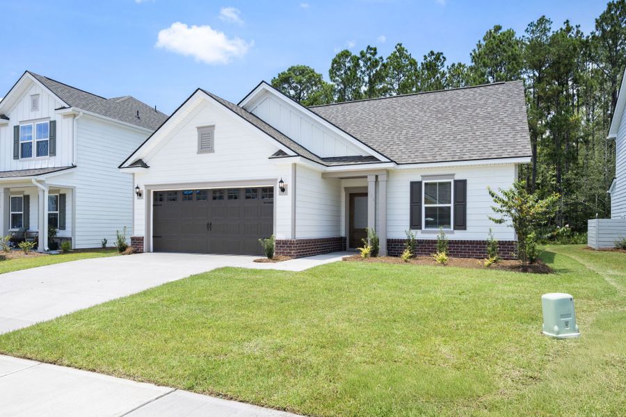 Front exterior of a new home in Waterways, Richmond Hill, GA, highlighting curb appeal (Image 18).