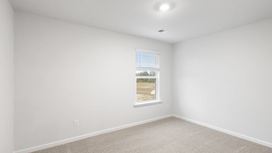 Spacious, unfurnished interior of a new home in Pine Hills at Cane Bay, Summerville (Image 19).