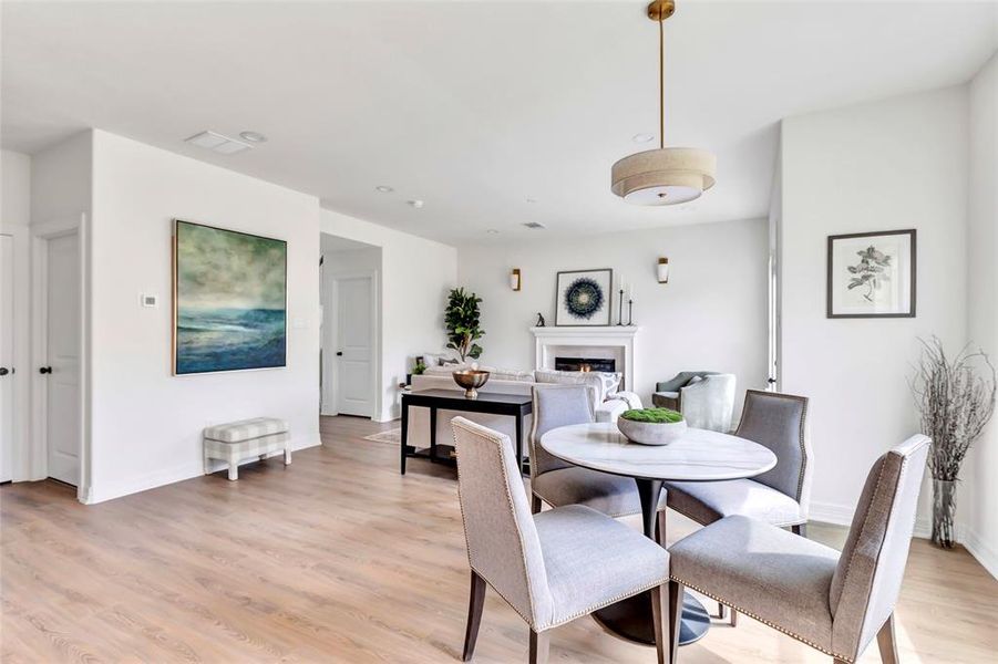 Bright dining area with stylish overhead lighting.