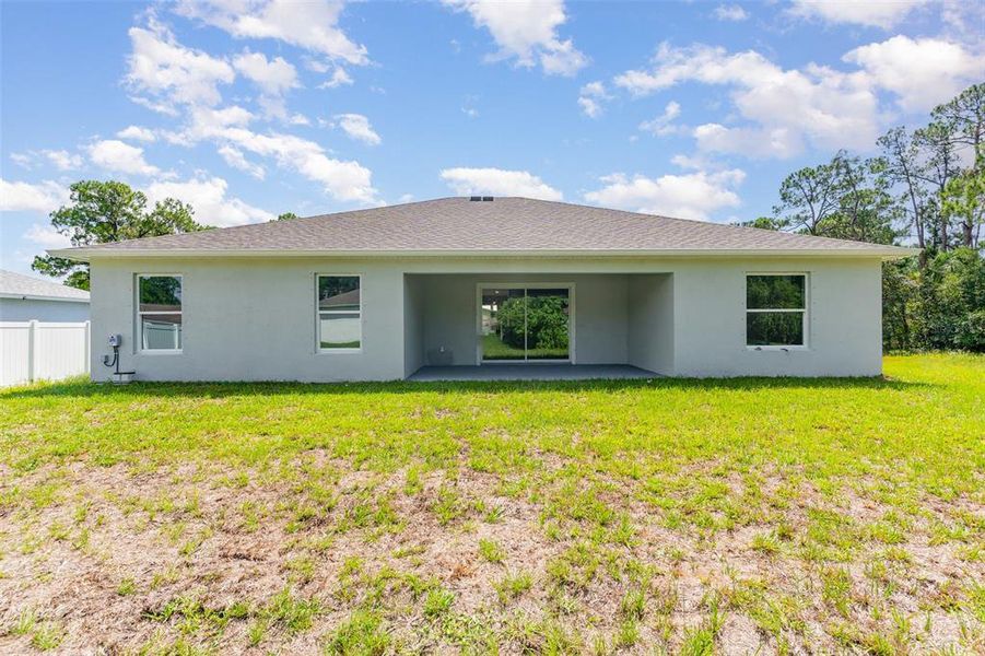 Front exterior of a new home in , Palm Bay, FL, highlighting curb appeal (Image 2).