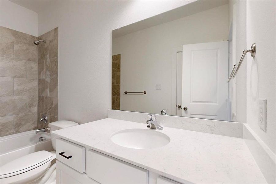 Bathroom featuring vanity and bathing tub / shower combination