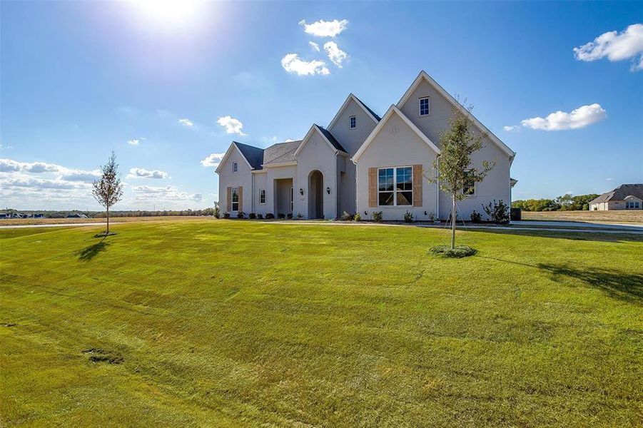 View of front of house with a front yard