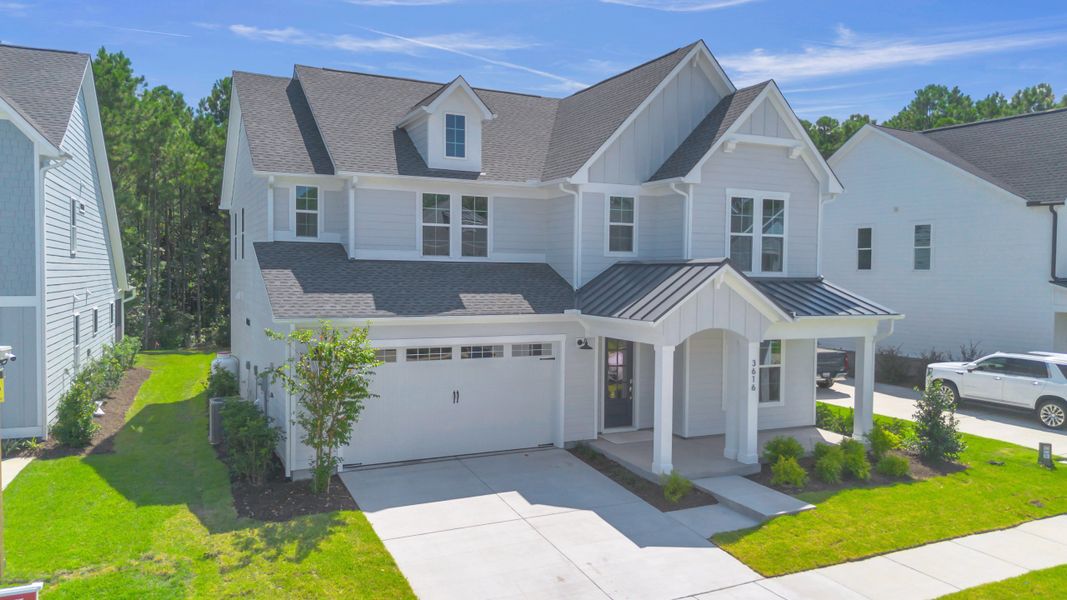 Representative exterior photo of a completed home built from the The Hampton by RobuckHomes in Stonehenge, Raleigh, NC (Image 36).