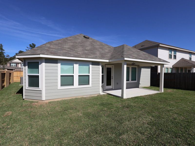 Exterior details and patio area of a home in Pinewood at Grand Texas, New Caney (Image 1).