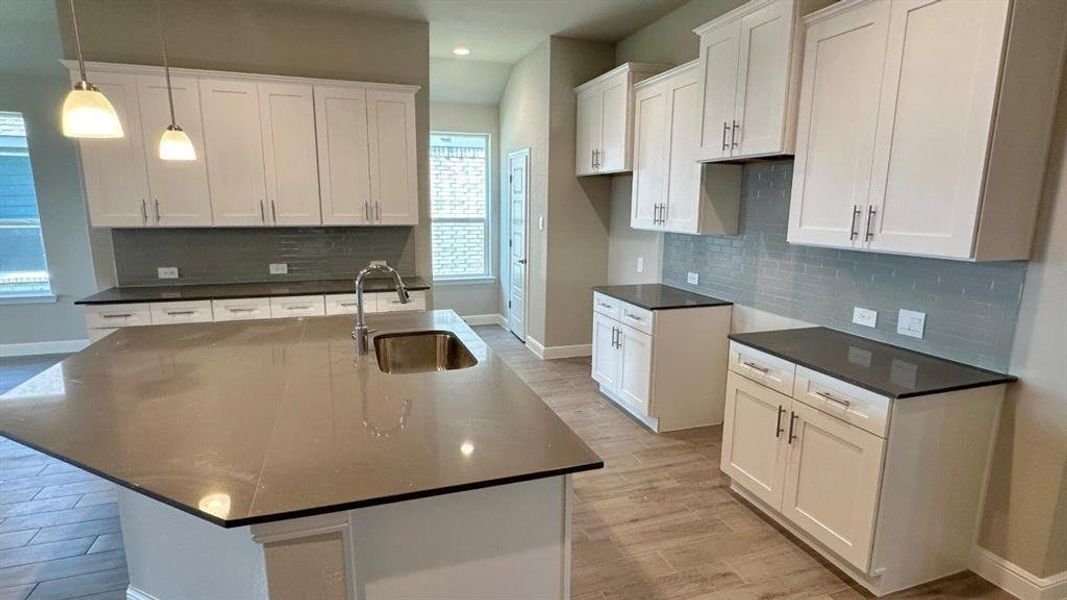 Kitchen - All Home and community information, including pricing, included features, terms, availability and amenities, are subject to change at any time without notice or obligation. All Drawings, pictures, photographs, video, square footages, floor plans, elevations, features, colors and sizes are approximate for illustration purposes only and will vary from the homes as built.