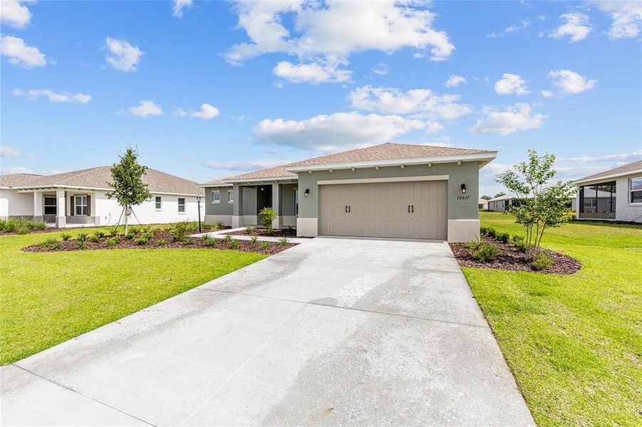 Front exterior of a new home in , Ocala, FL, highlighting curb appeal (Image 18). Front exterior of a new home in , Ocala, FL, highlighting curb appeal (Image 18).