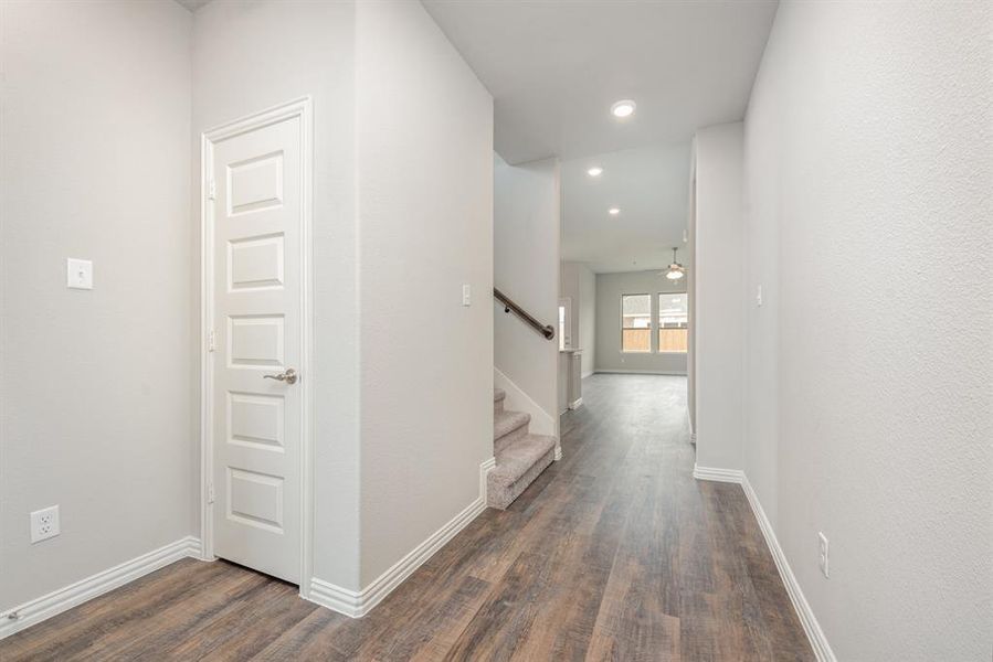 Corridor featuring dark hardwood / wood-style flooring