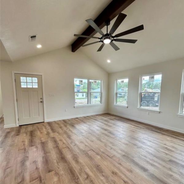 Vast vaulted ceilings and abundant natural light create an inviting atmosphere.
