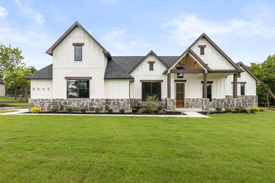 Front exterior of a new home in , Godley, TX, highlighting curb appeal (Image 20). Front exterior of a new home in , Godley, TX, highlighting curb appeal (Image 20).