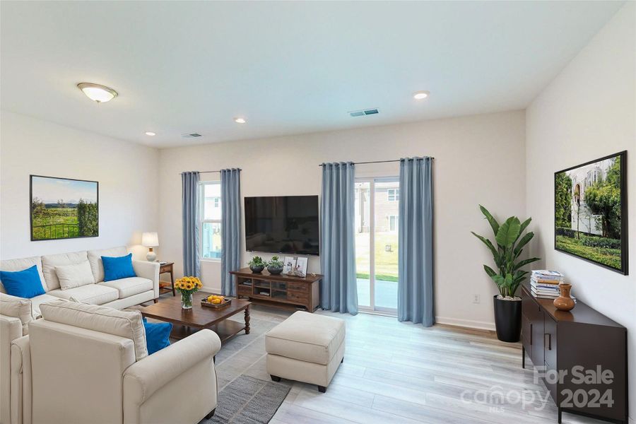 Family room shown with virtual staging