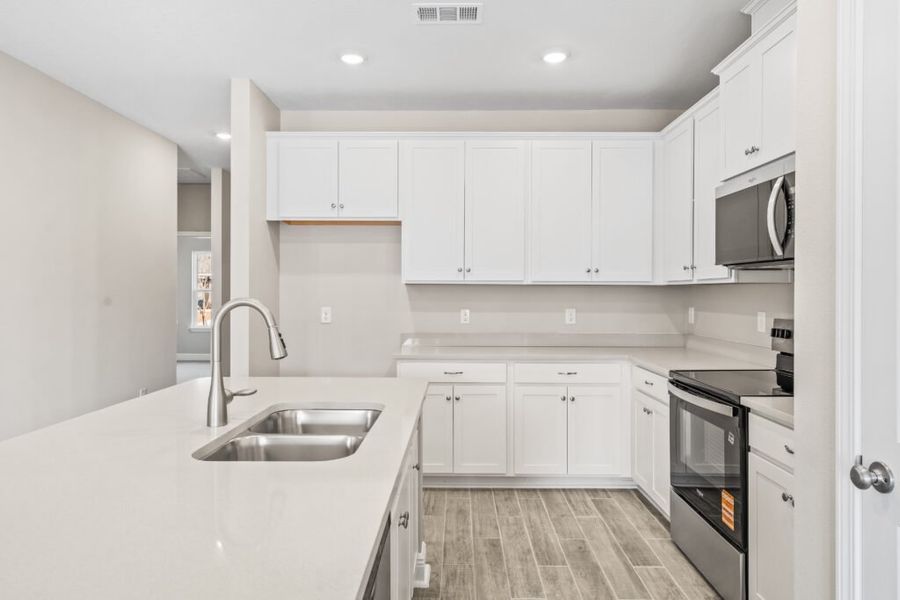 Furnished interior view inside a new home in Natureview, Freeport (Image 9).