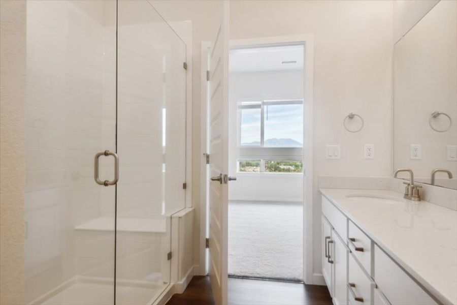 A bathroom with a glass shower. A bathroom with a glass shower.