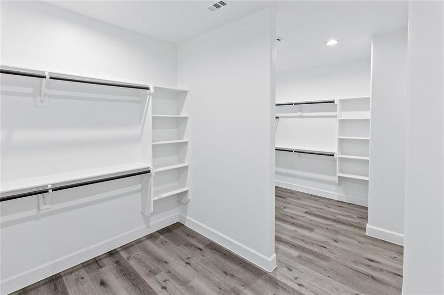 Walk in closet featuring light wood-type flooring