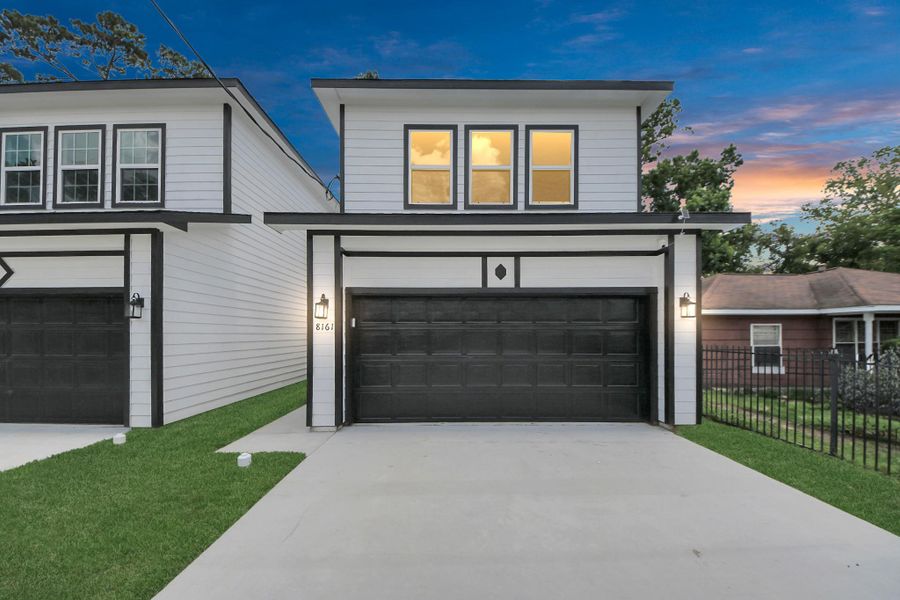 Front exterior of a new home in , Houston, TX, highlighting curb appeal (Image 1).