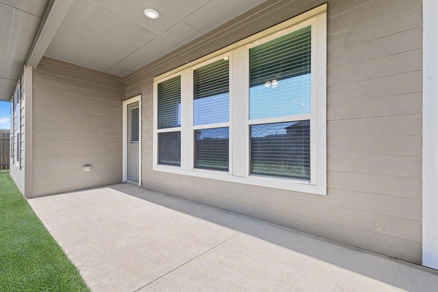 Exterior details and patio area of a home in Mill Creek Trails, Magnolia (Image 21).