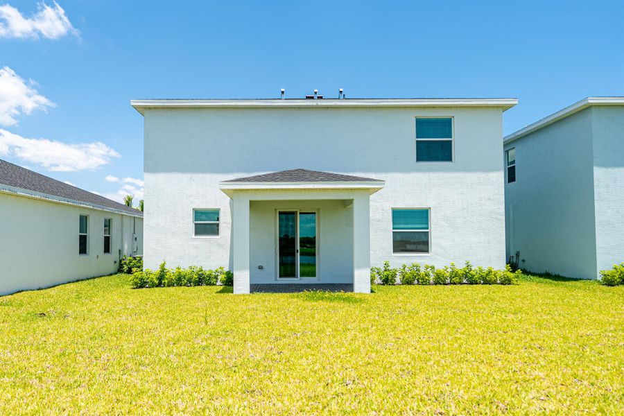 Front exterior of a new home in , Fort Pierce, FL, highlighting curb appeal (Image 18). Front exterior of a new home in , Fort Pierce, FL, highlighting curb appeal (Image 18).