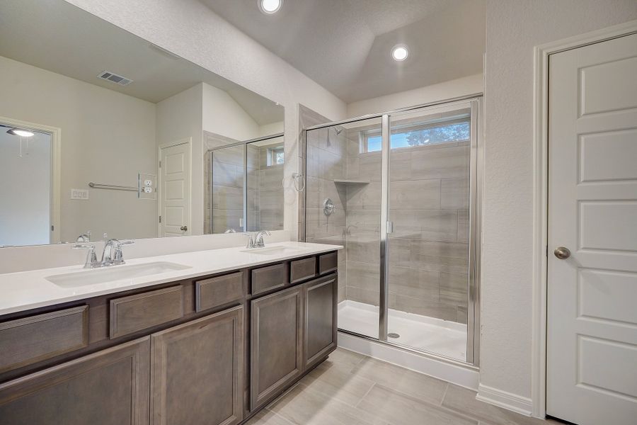 Primary suite bathroom in the Oleander floorplan at a Meritage Homes community.