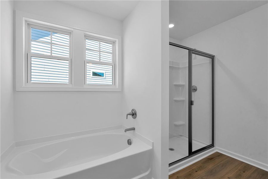 This bathroom features a deep soaking tub and a sp