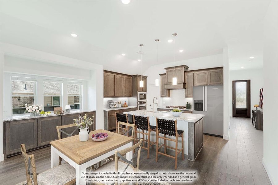 Open kitchen and dining area with dark wood cabinets, center island with seating, and hardwood floors Open kitchen and dining area with dark wood cabinets, center island with seating, and hardwood floors