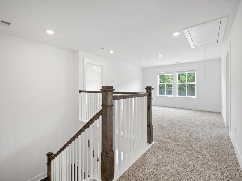 Spacious, unfurnished interior of a new home in The Coves at Lakes of Cane Bay, Summerville (Image 24).