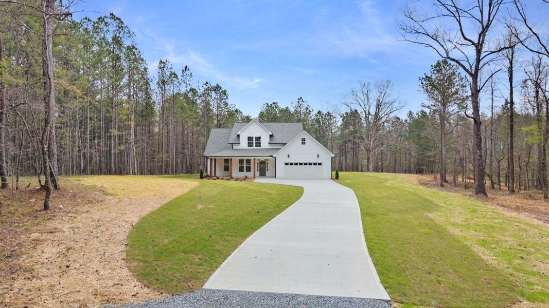 Front exterior of a new home in , Calhoun, GA, highlighting curb appeal (Image 16).